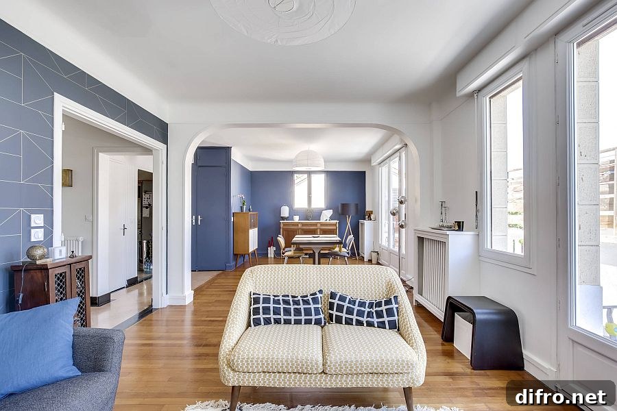 Spacious modern living room in white with dark blue accent wall