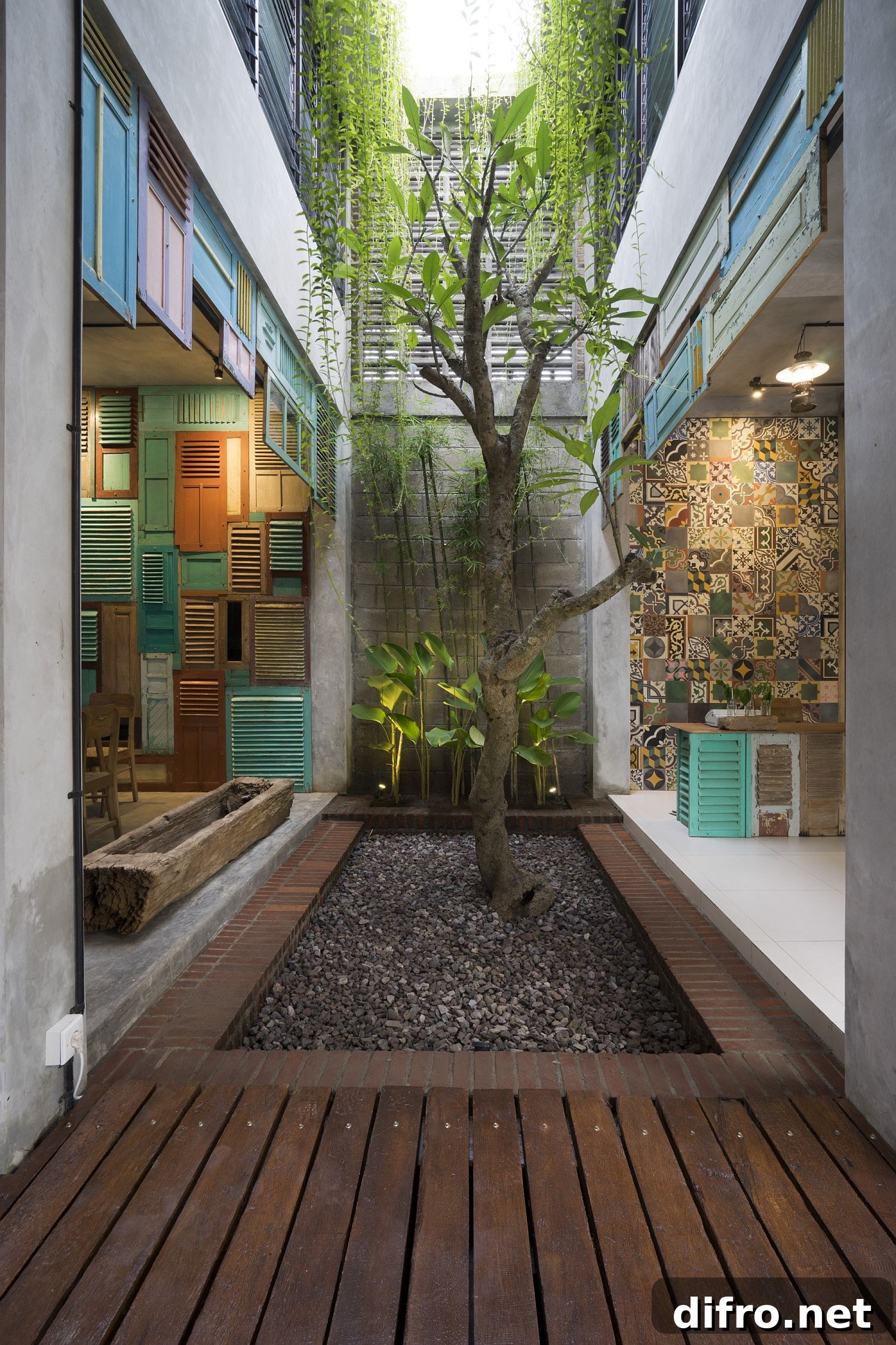 Vintage wooden panels and patterned tiles in a modern atrium