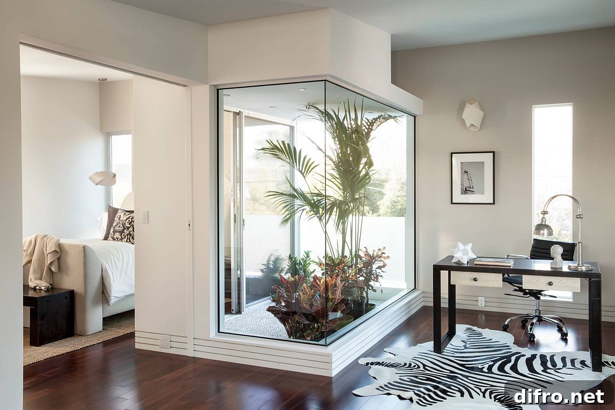 Small atrium bringing light into bedroom and adjacent home office
