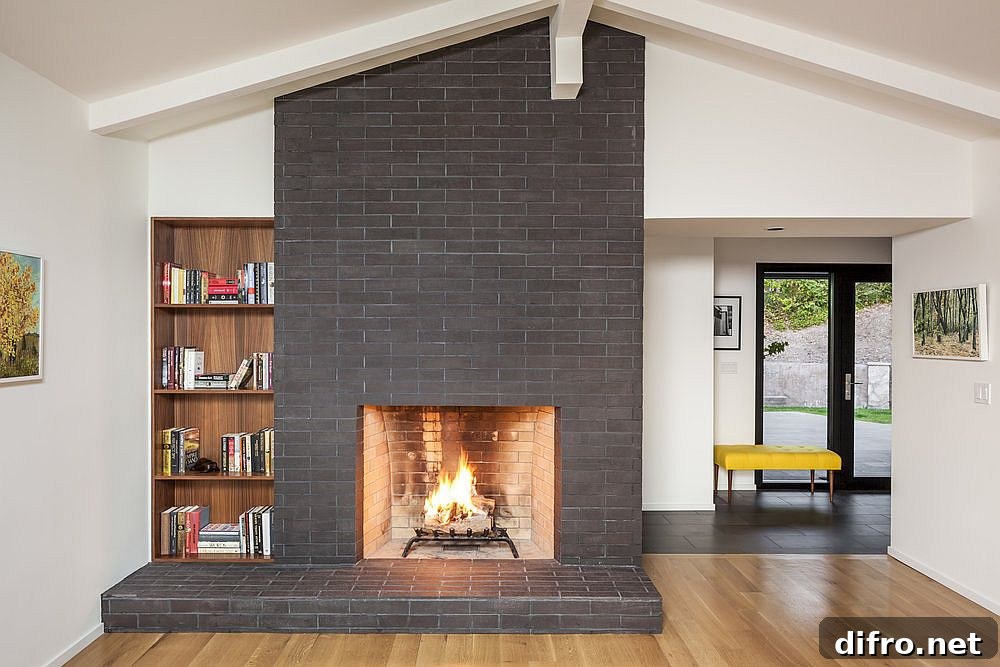 Gray fireplace with wooden bookshelf in white living room