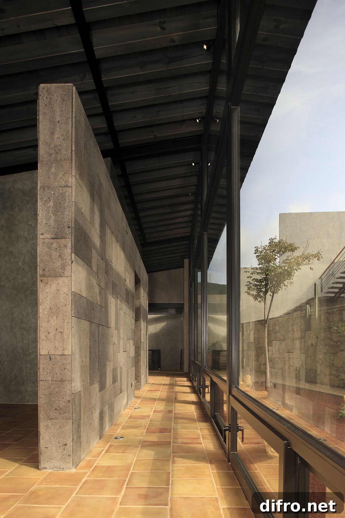 Series of covered verandahs around the house link public and private areas