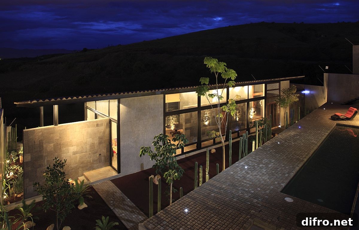 View of the garden, pool area and the house along with the distant valley