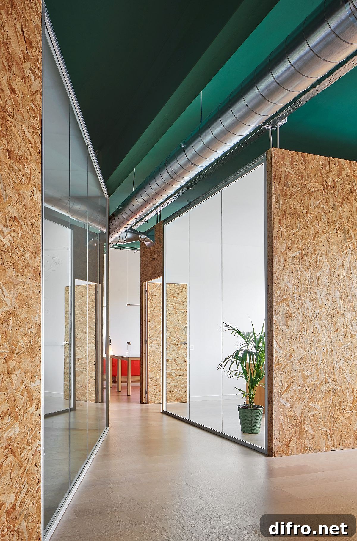 Two distinct white and wood boxes serve different functions inside the industrial shell
