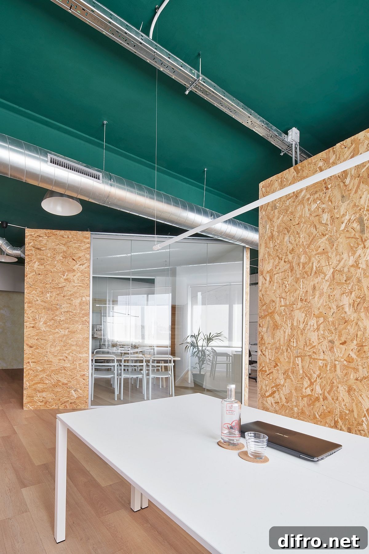Green painted ceiling adds a fresh accent to the neutral interior