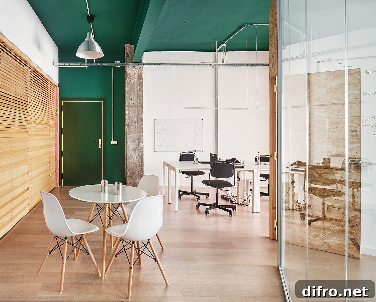 Modern industrial office combining green ceiling and white decor