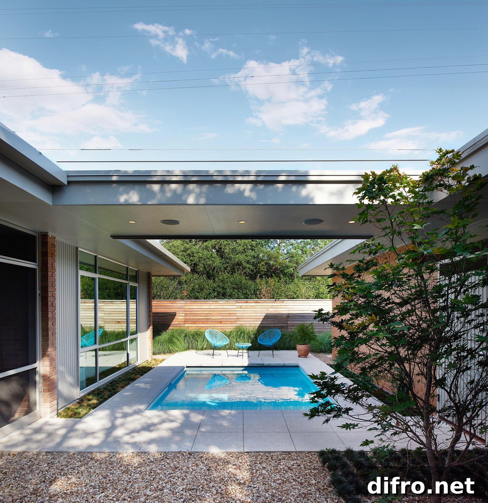 Sheltered outdoor spaces and pool area at the revamped home in Austin