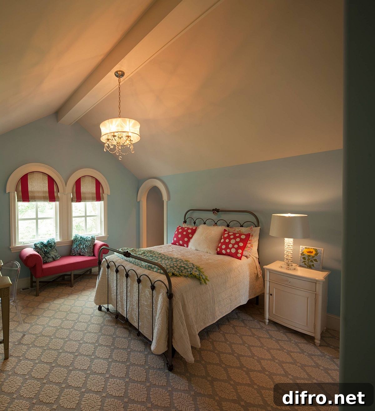 Traditional attic bedroom with arched windows