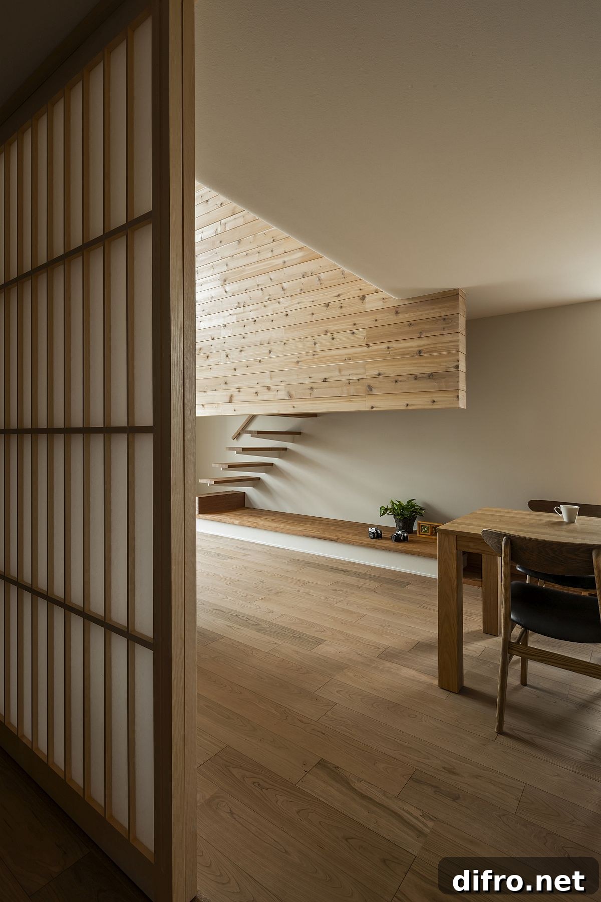 Sliding windows bringing natural light into the double-height living room