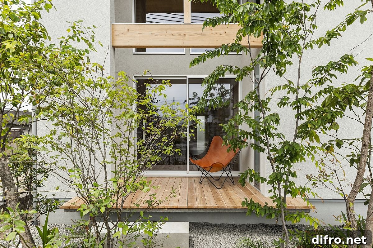 Small wooden deck surrounded by greenery providing a relaxing refuge