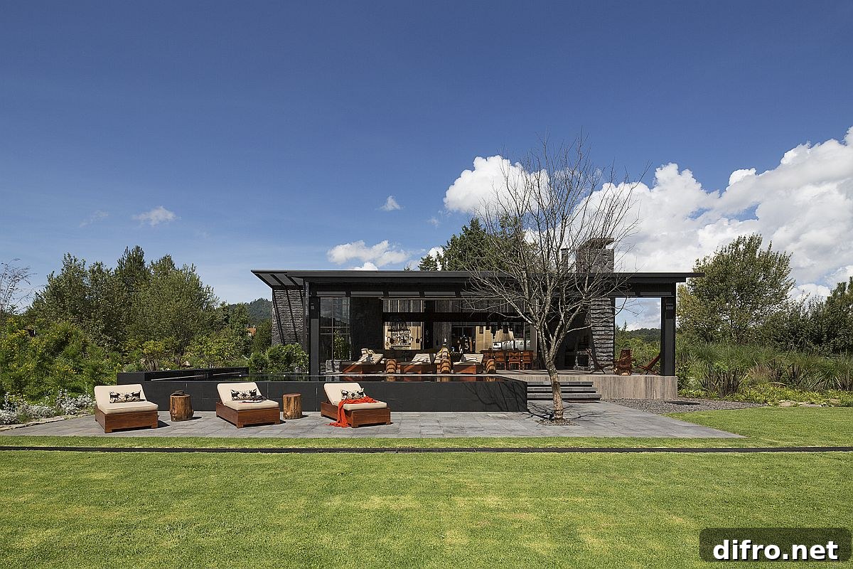 Outdoor hangout and pool area surrounded by garden