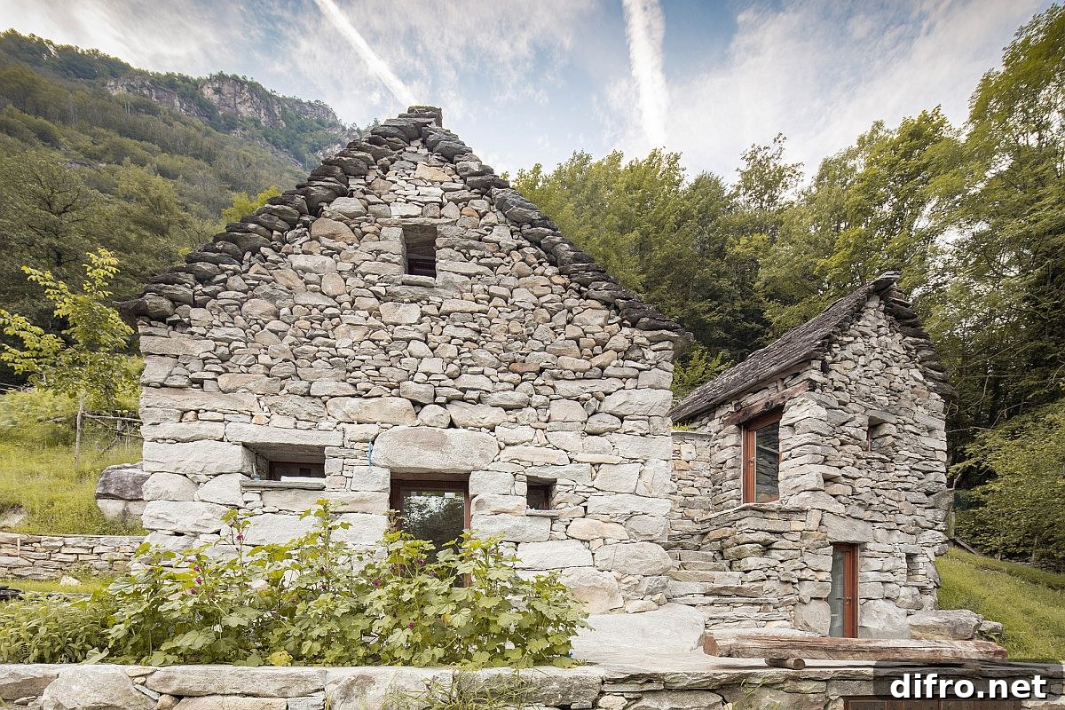Stone exterior of Casa Lucciola in Corippo, Switzerland