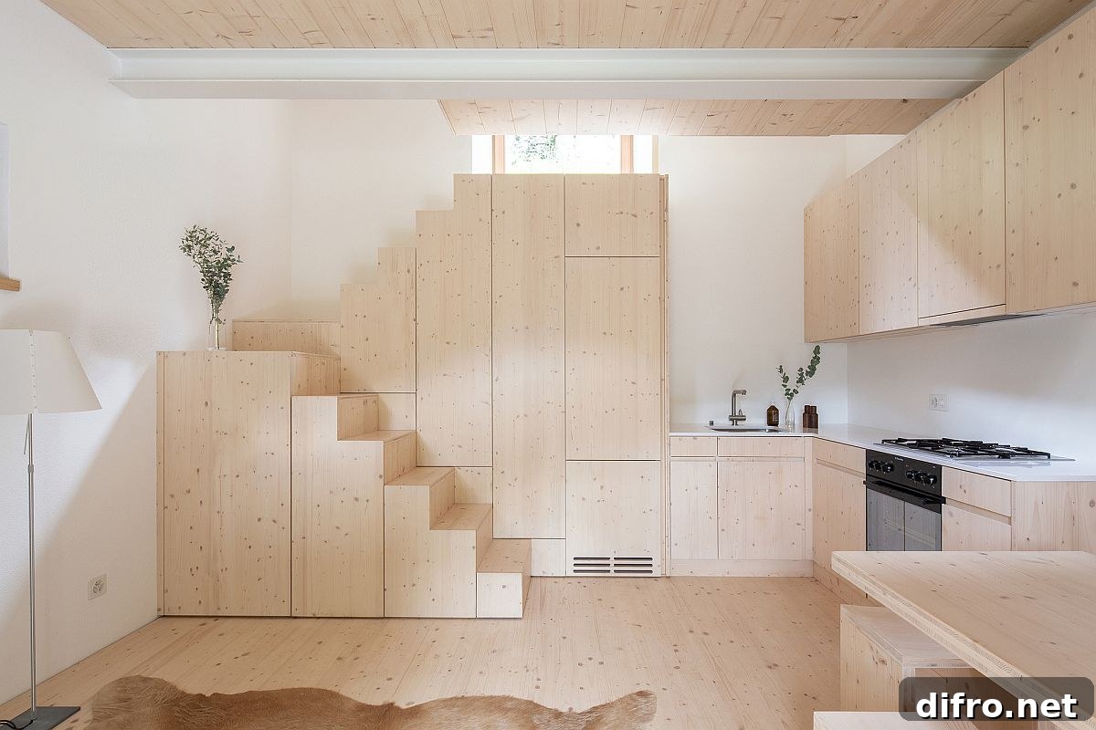 Box-styled wooden steps and built-in cabinets maximize storage