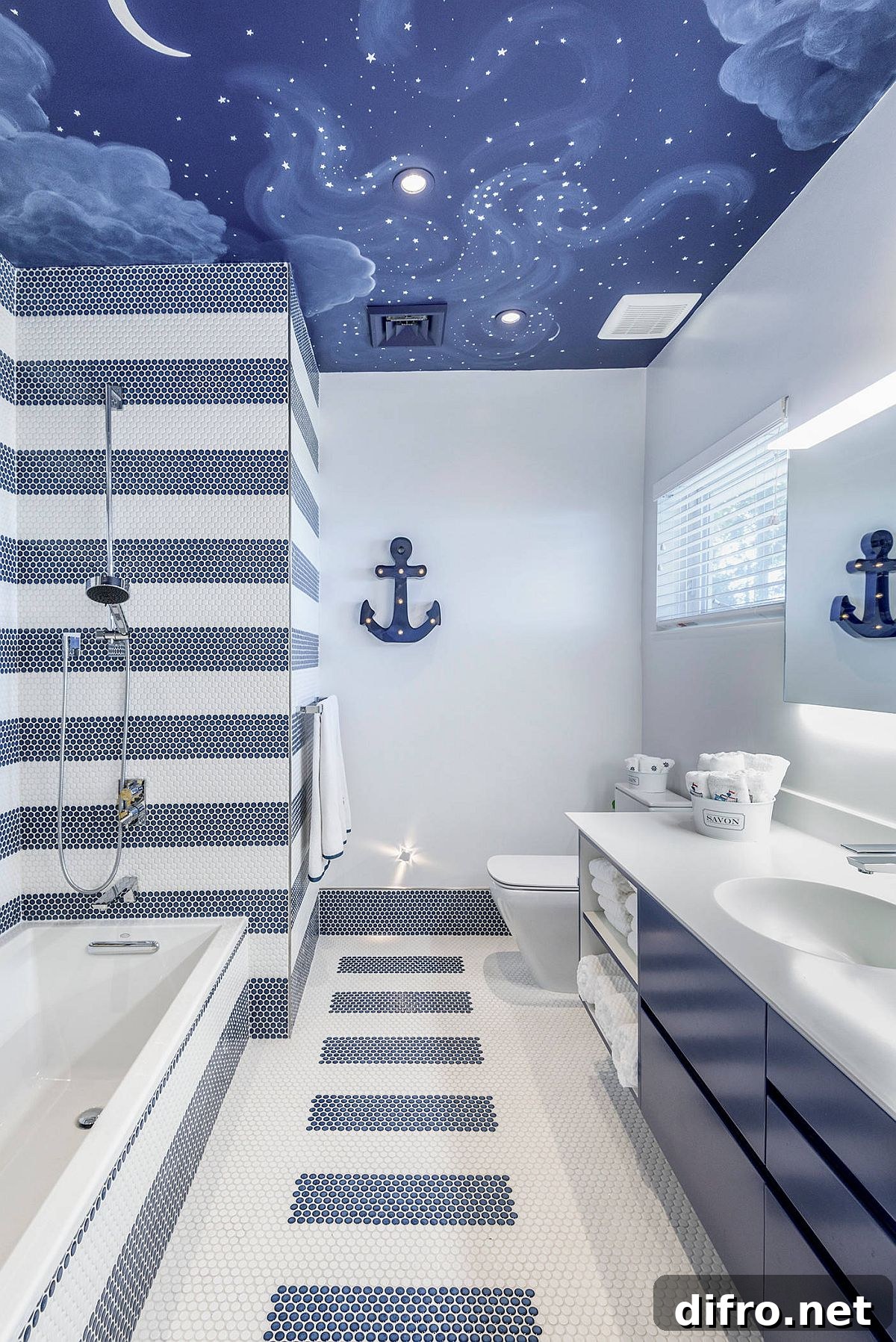Kids' bathroom with painted ceiling and blue-and-white tiles