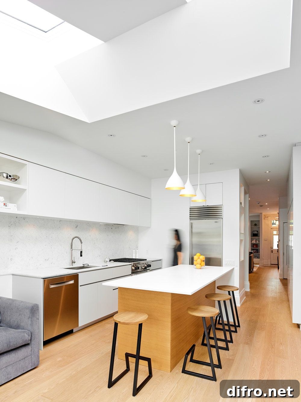 Light-filled and white interior of the Macpherson Renovation in Toronto