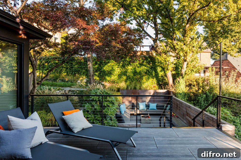 Deck of the house in wood with staircase that leads to the sunken patio below