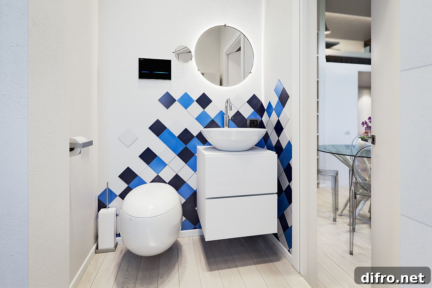 Small bathroom in white with pops of blue and dark gray