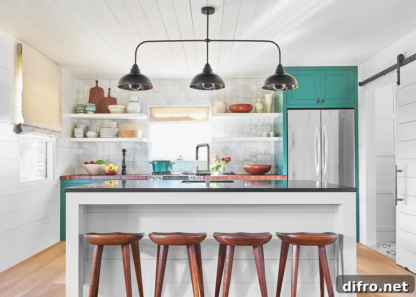 Relaxing ranch style kitchen in white with a splash of teal that brings brightness