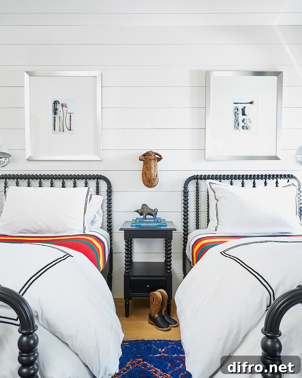 Beds with iron frame enhance the traditional ranch style of the bedroom in white