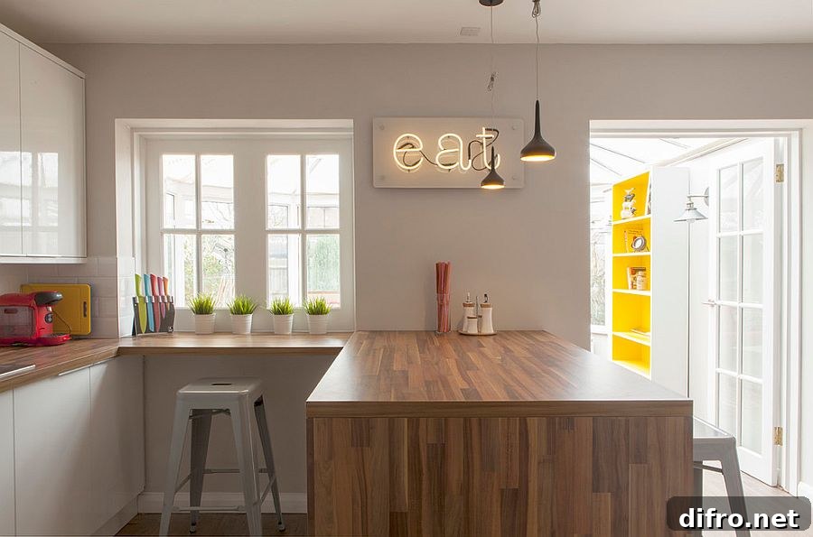 Modest modern kitchen in gray feels far more brighter thanks to the neon sign