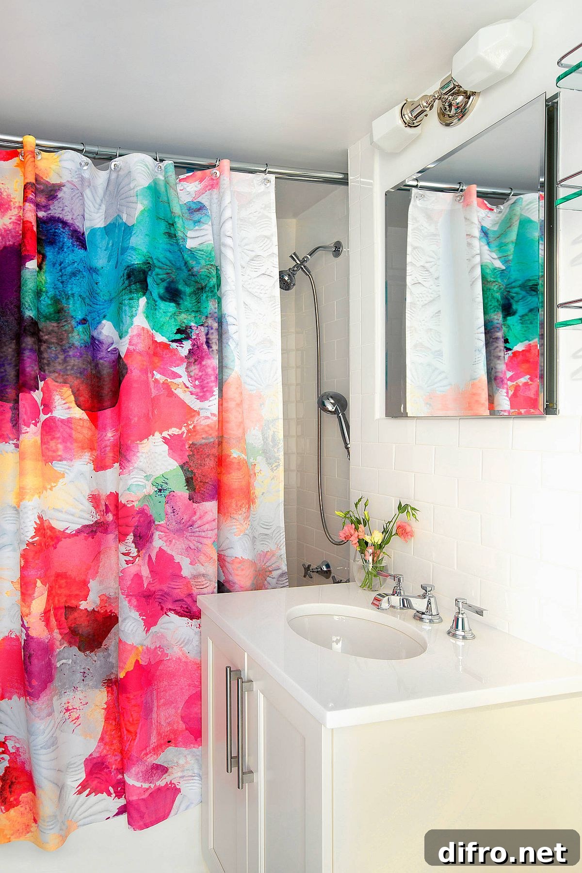 Shower curtains adding pink and purple to a neutral bathroom