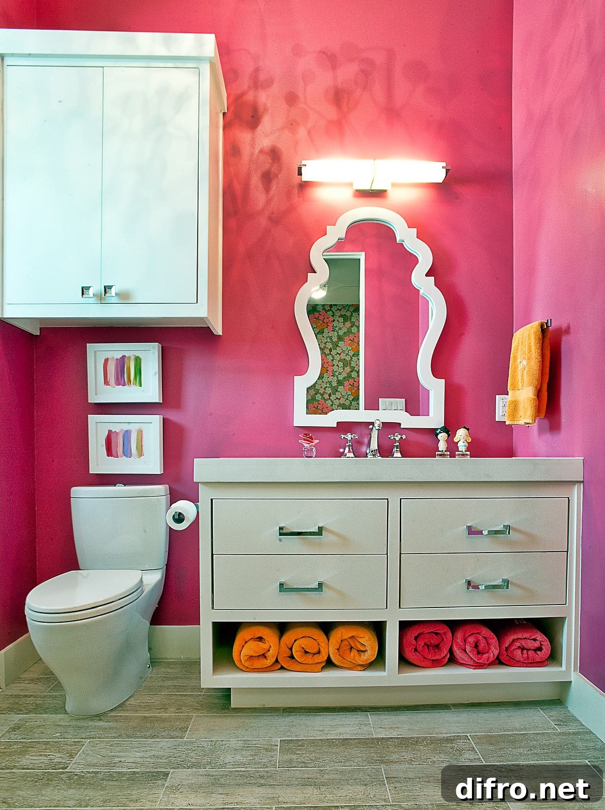 Bathroom brightened by fuchsia accents