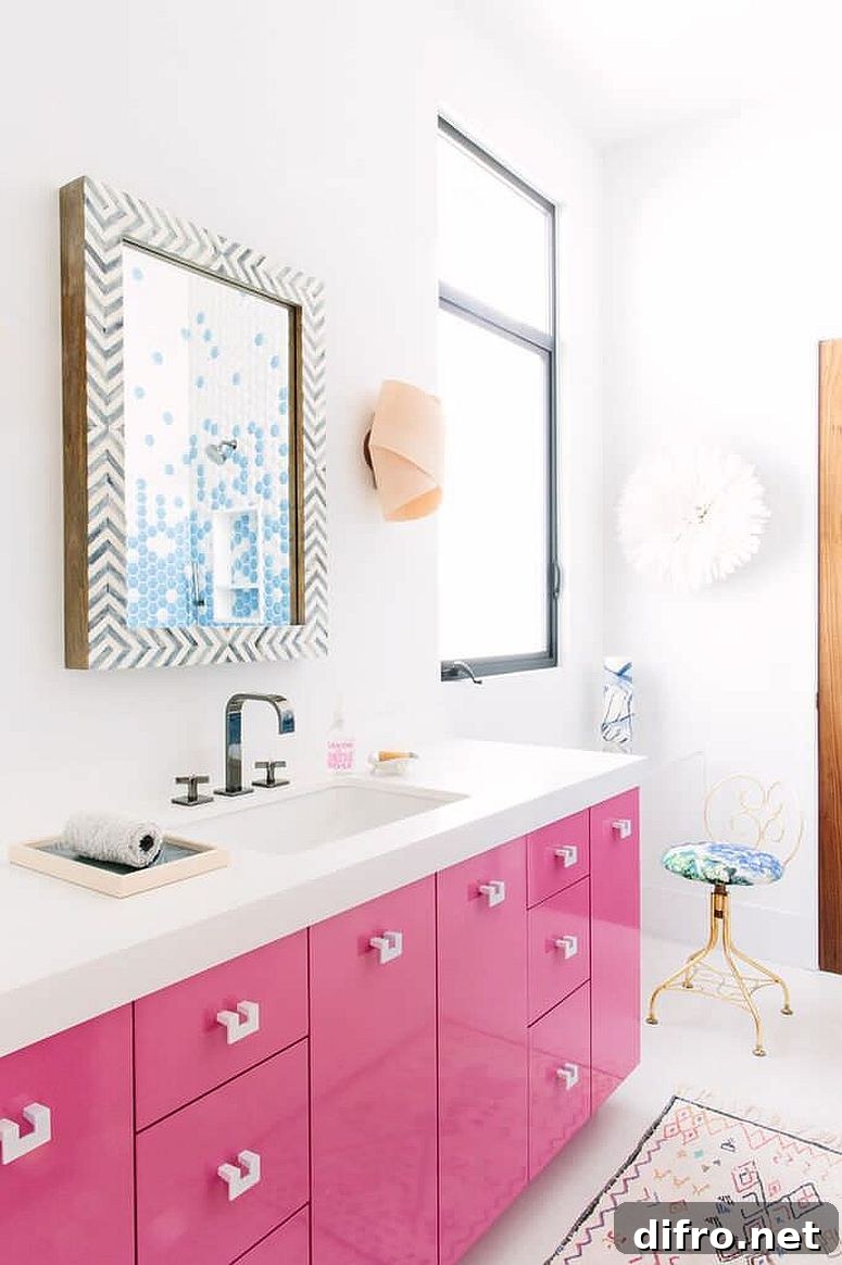 Pink vanity with white countertop and lacquer finish