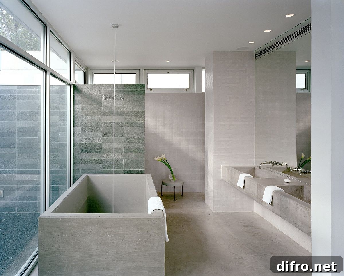 Spacious gray bathroom with blue tiled shower