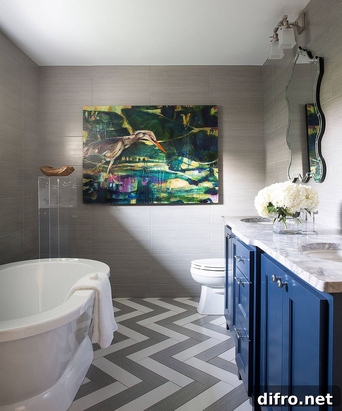 Chevron floor in white and gray with blue vanity