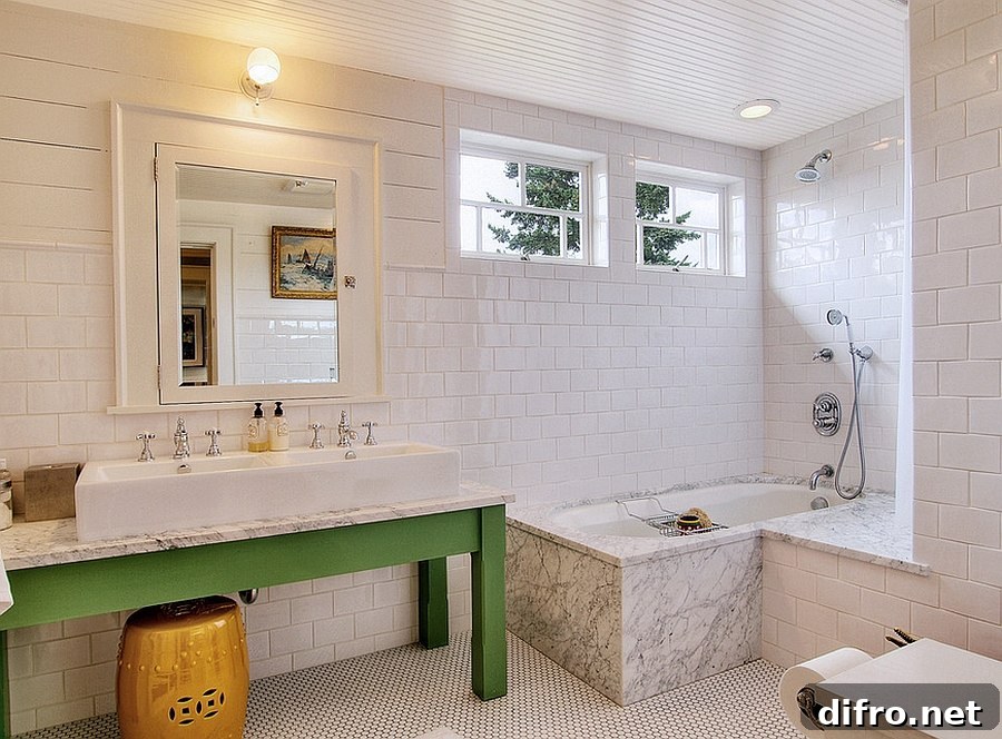 Wooden vanity painted green in a white bathroom