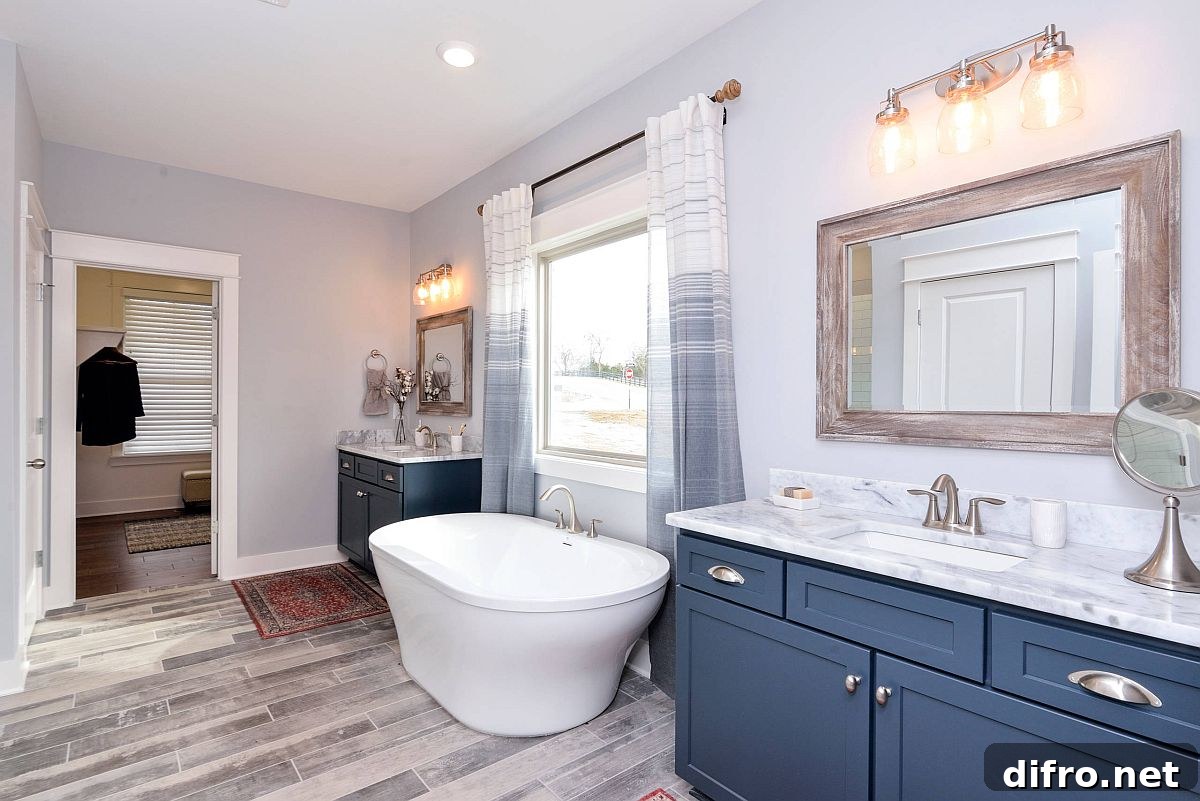 Gray master bathroom with wooden floor and bright blue vanity