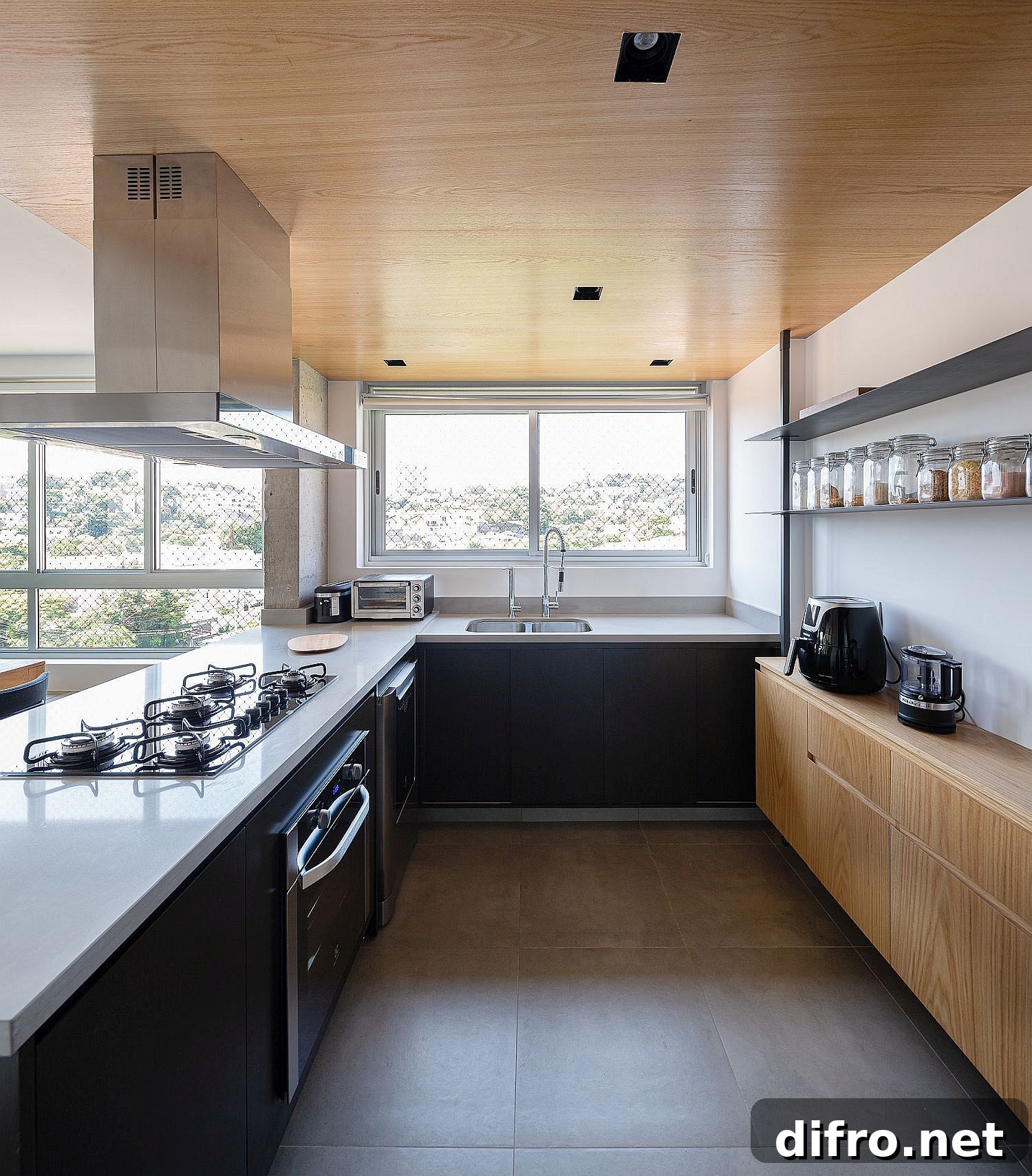 Modern kitchen with wooden shelving and ceiling that add warmth