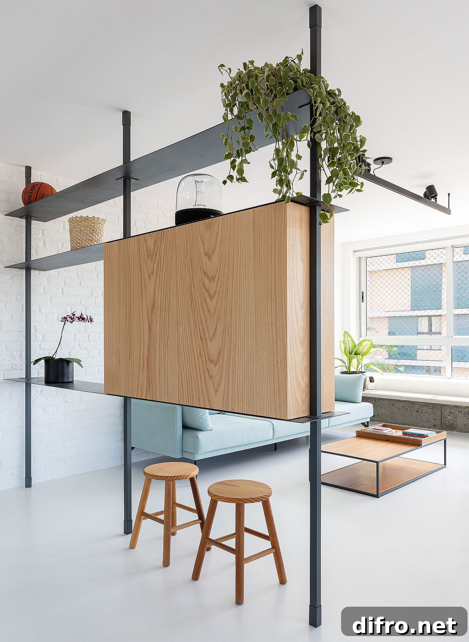 Standalone wall that separates the living area while providing space for a television
