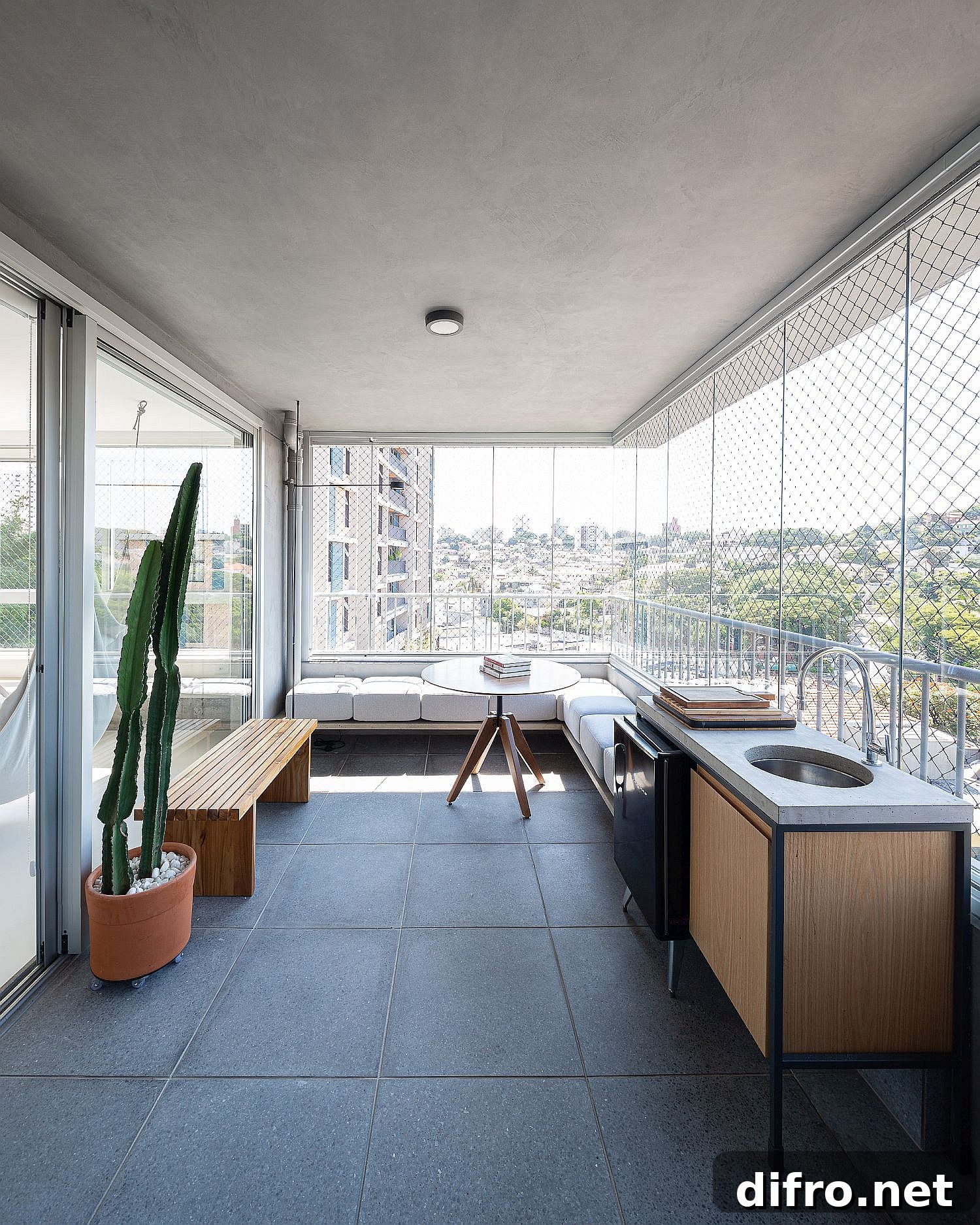Balcony with glass and mesh walls that extend the living area outdoors