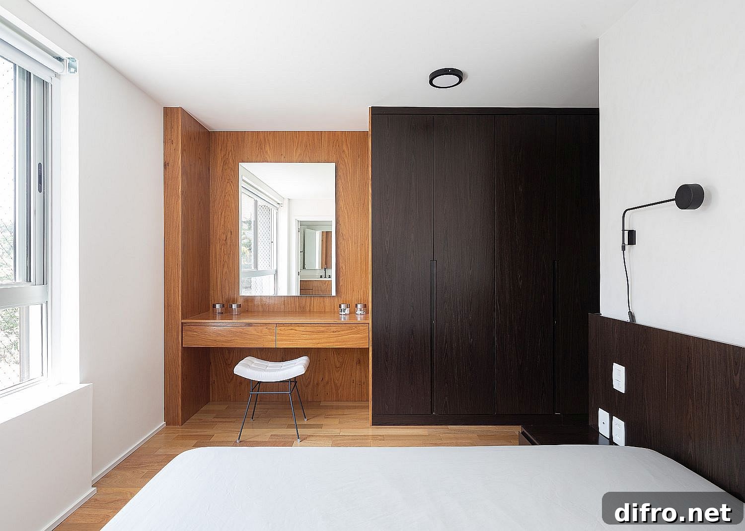 Modern bedroom finished in white and wood for an elegant, understated look
