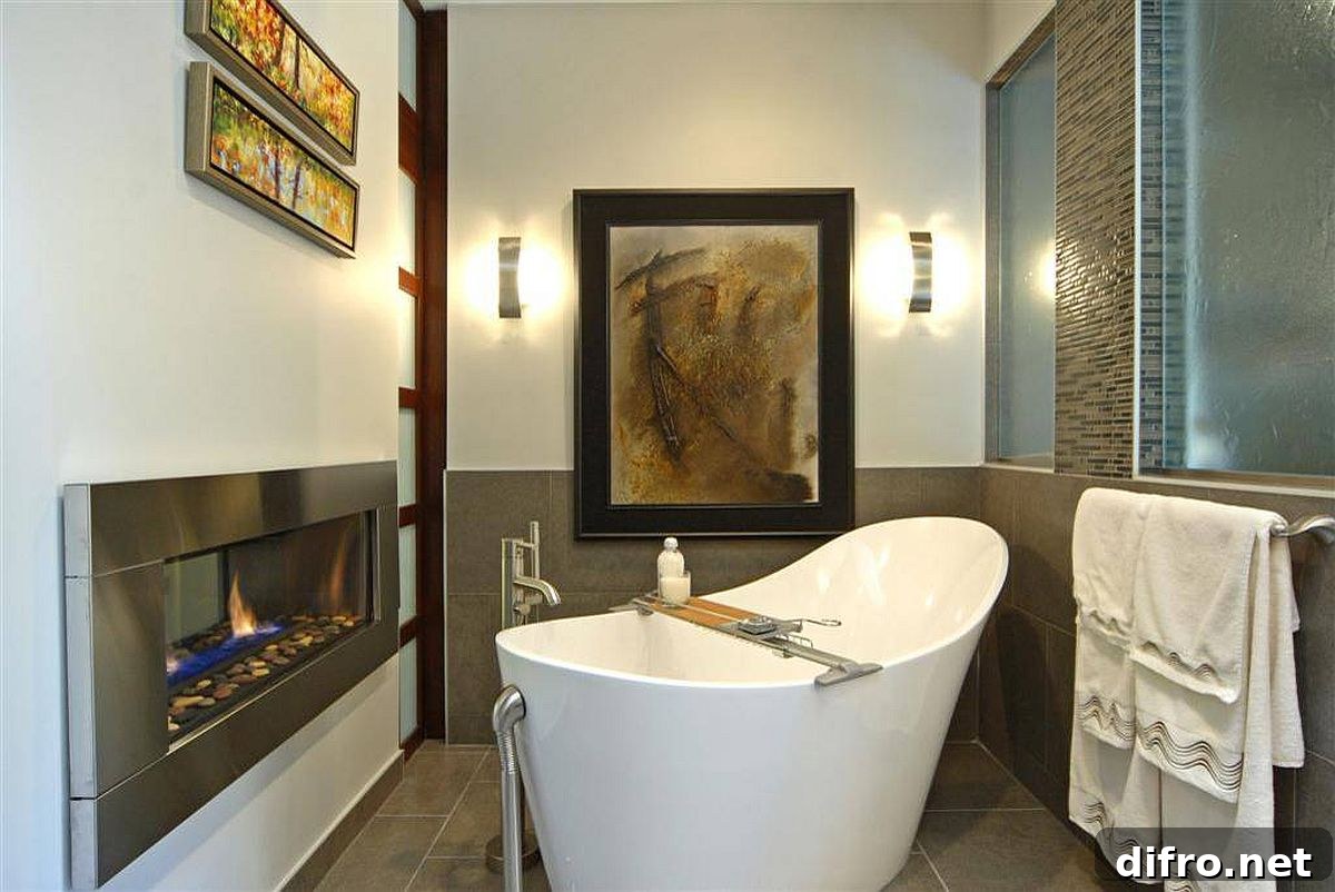 Soaking tub next to a fireplace in a modern-classic bathroom
