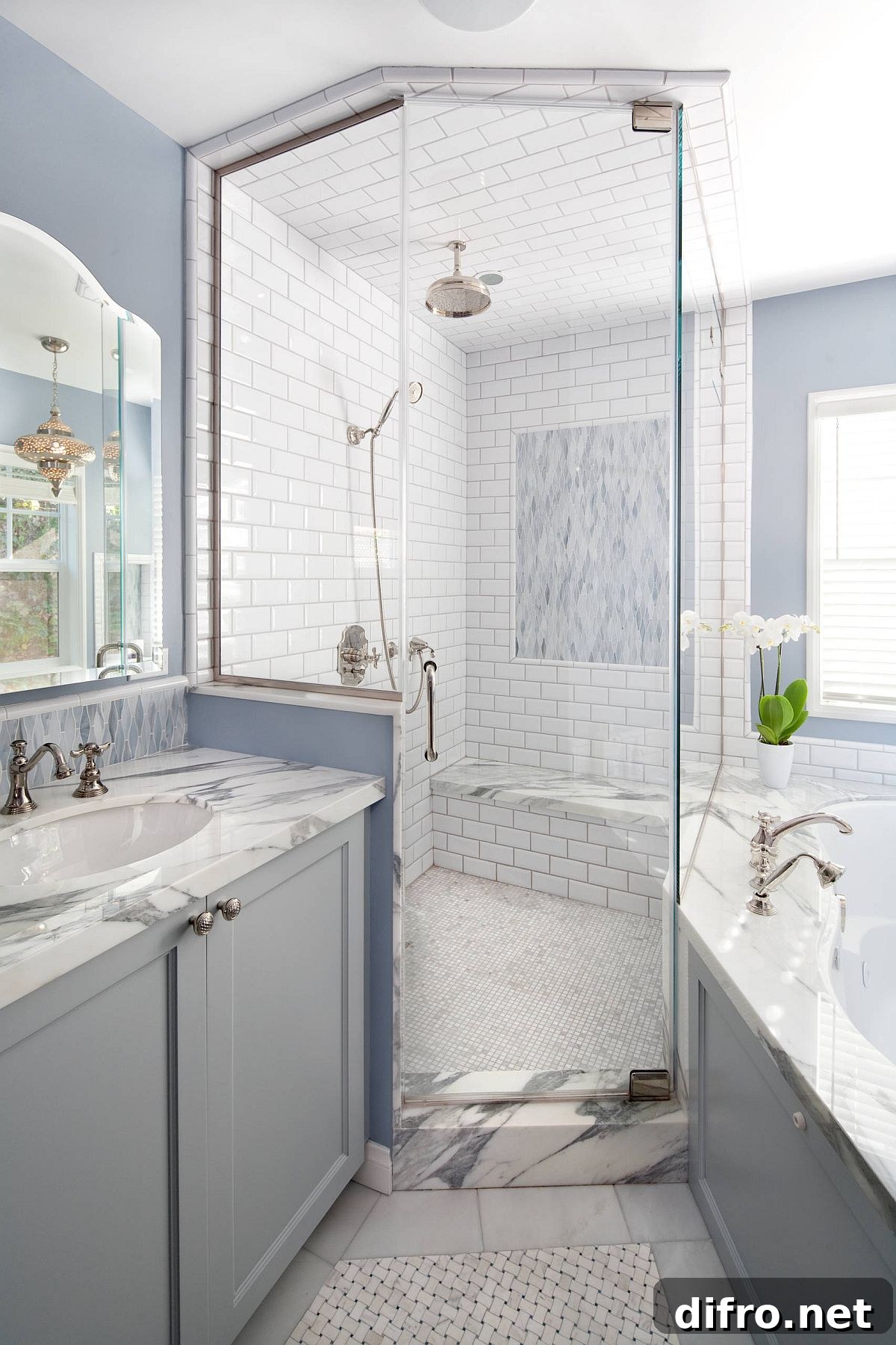 Beach-style bathroom in blue, gray and white with luxurious shower area