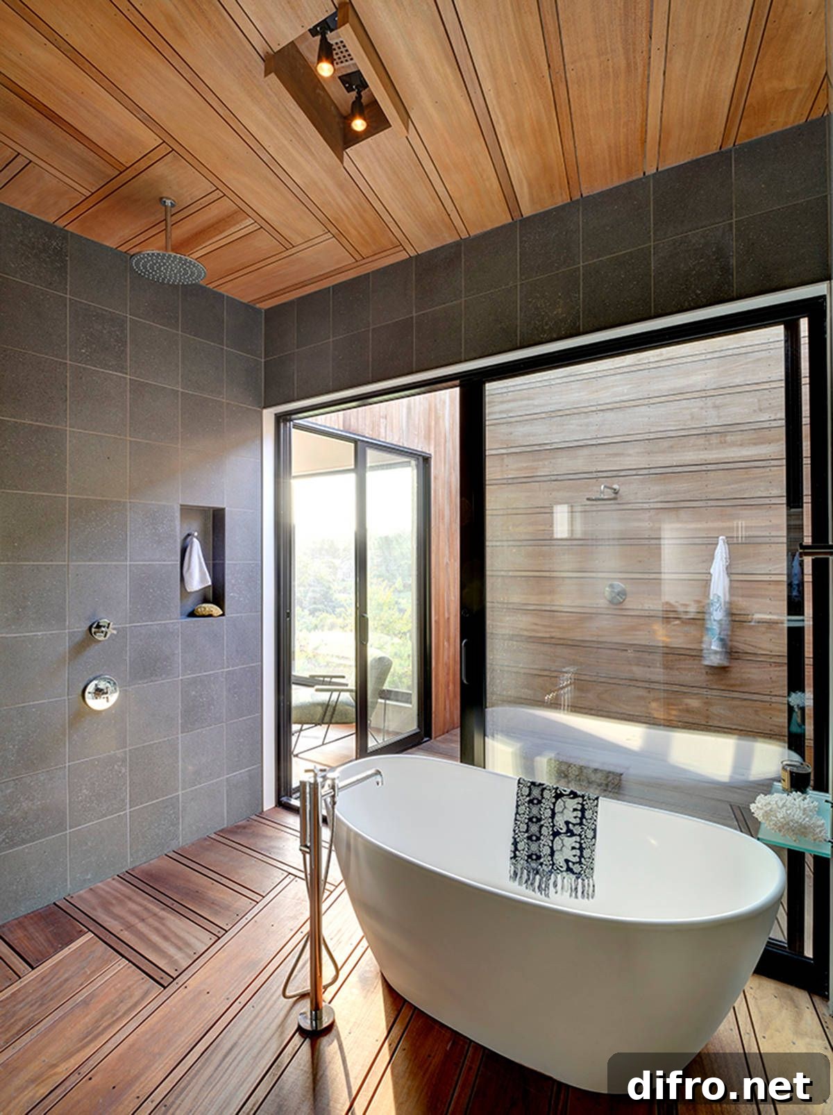 Modern gray and wood bathroom with freestanding bathtub and rainfall shower