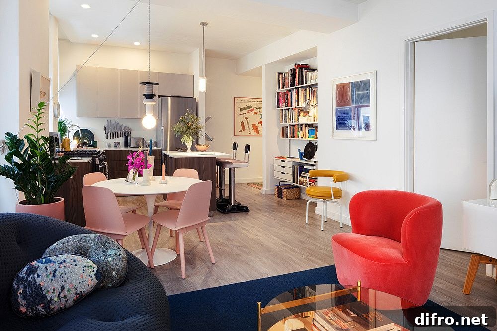 Gorgeous sofa in blue and chair in red add color to the modern living space