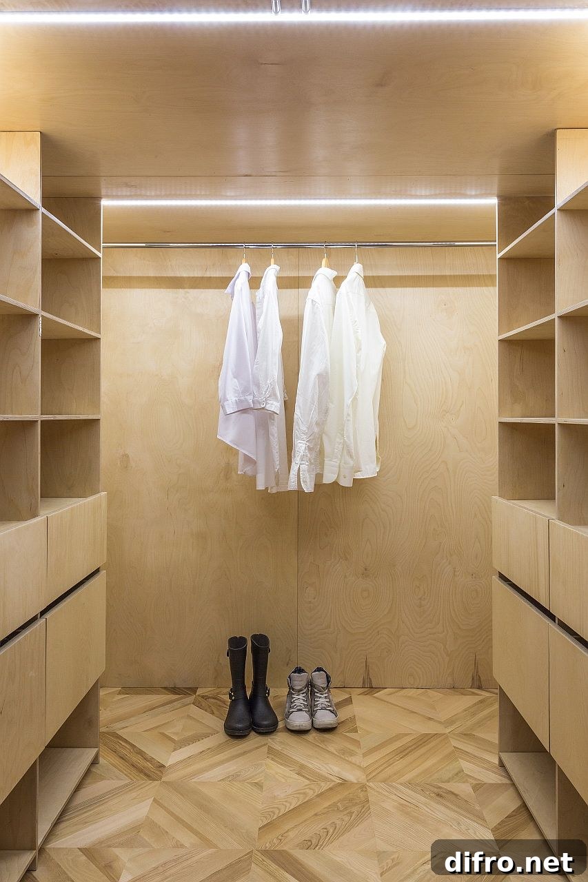 Walk-in wardrobe with wooden walls and lighting