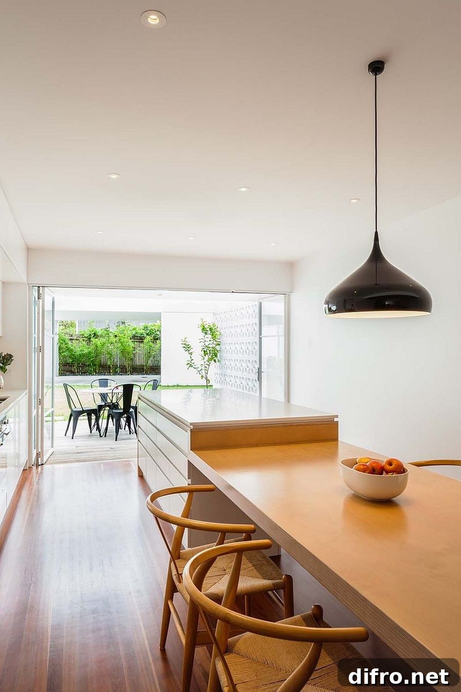Fabulous kitchen and dining space of the revamped cottage with a large breakfast bar