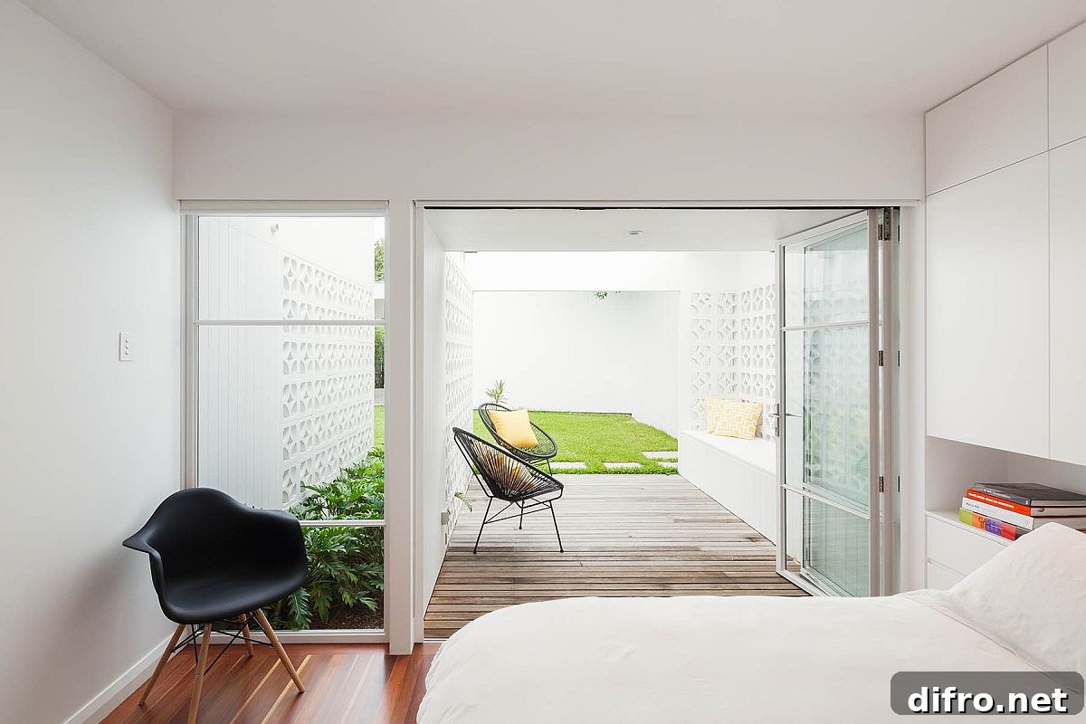Wooden deck extends from the bedroom and into the garden outside