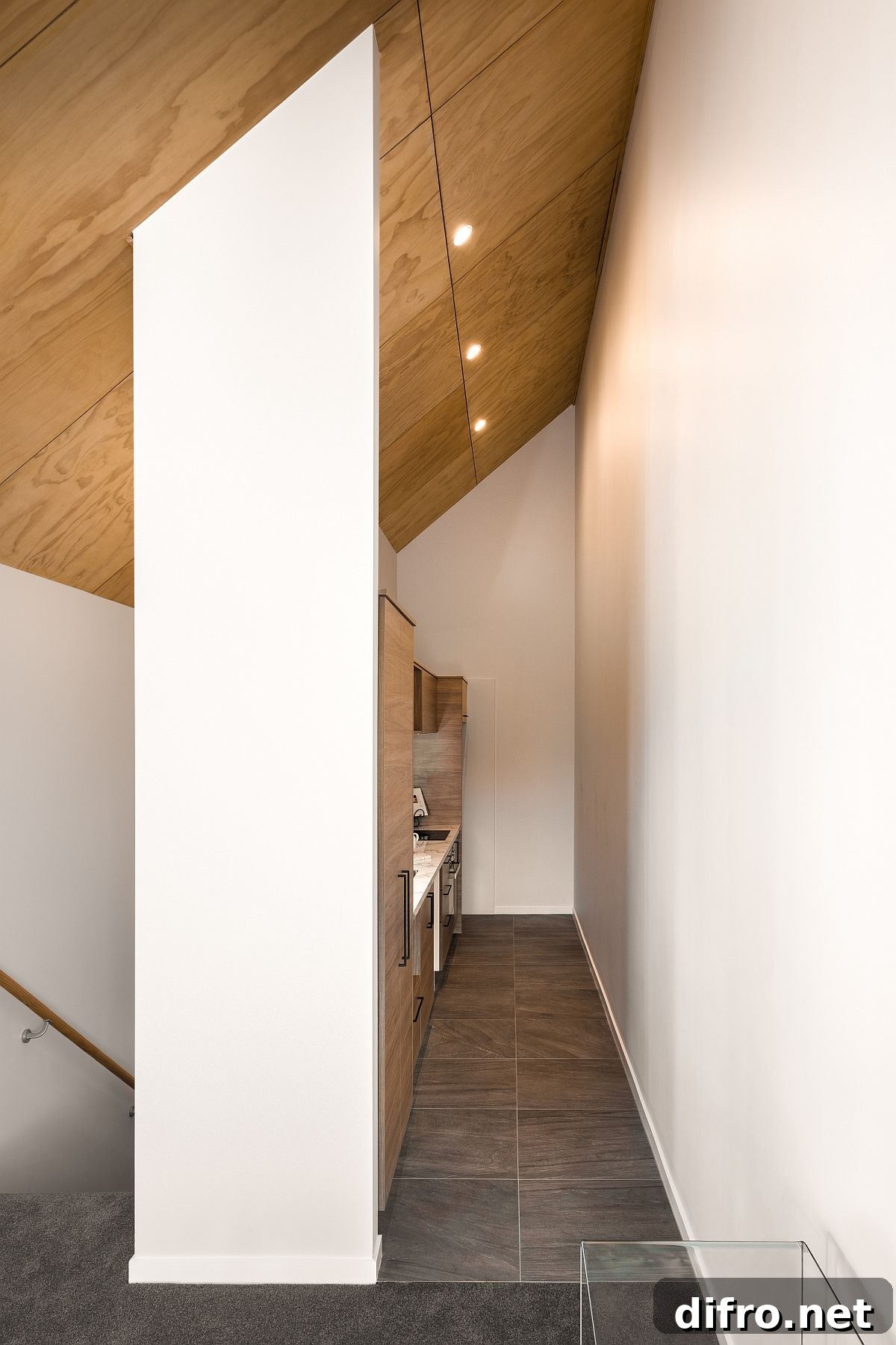Small narrow kitchen in wood and white