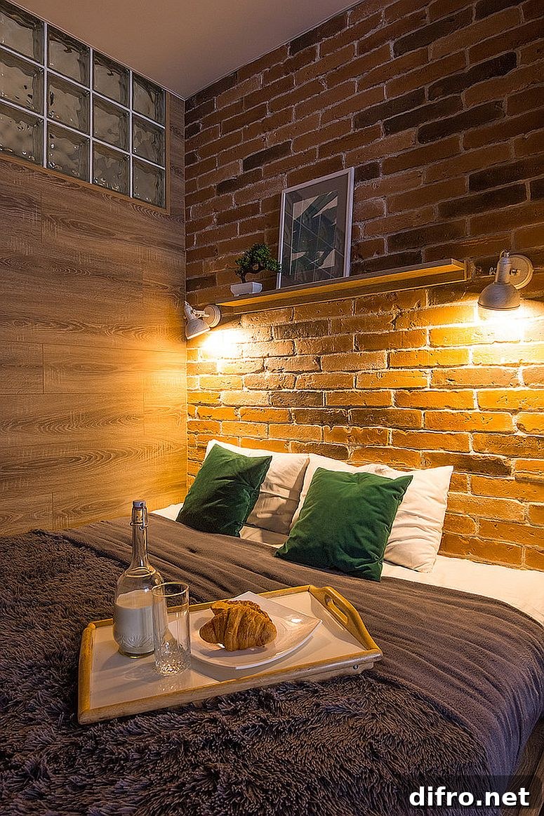 Sconce lighting on brick headboard