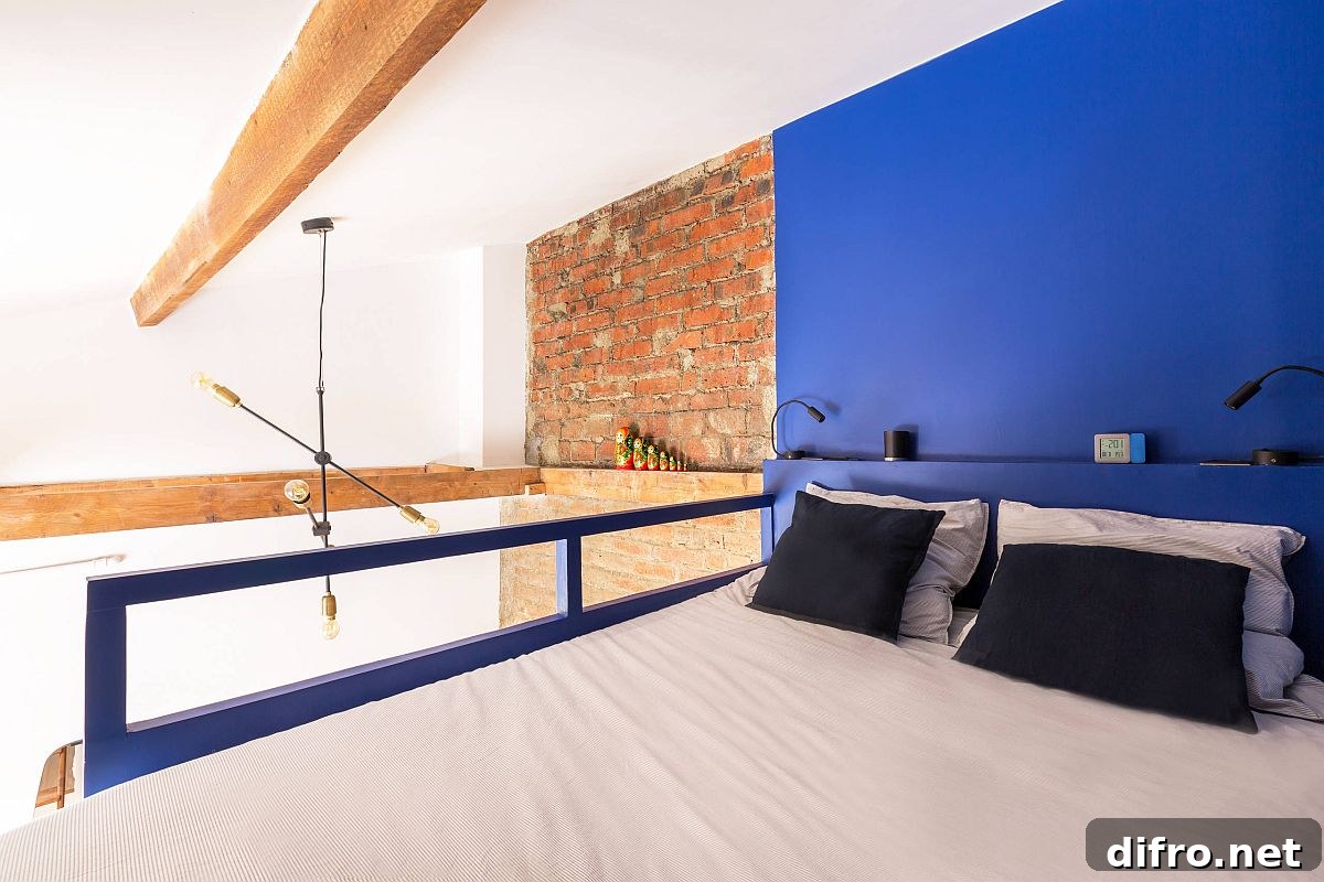 Tiny industrial bedroom with blue accent wall