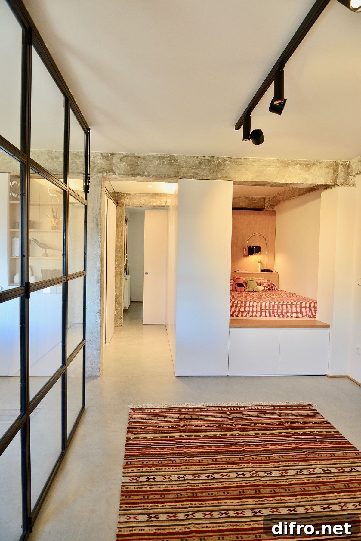 Tiny niche turned into cozy bedroom