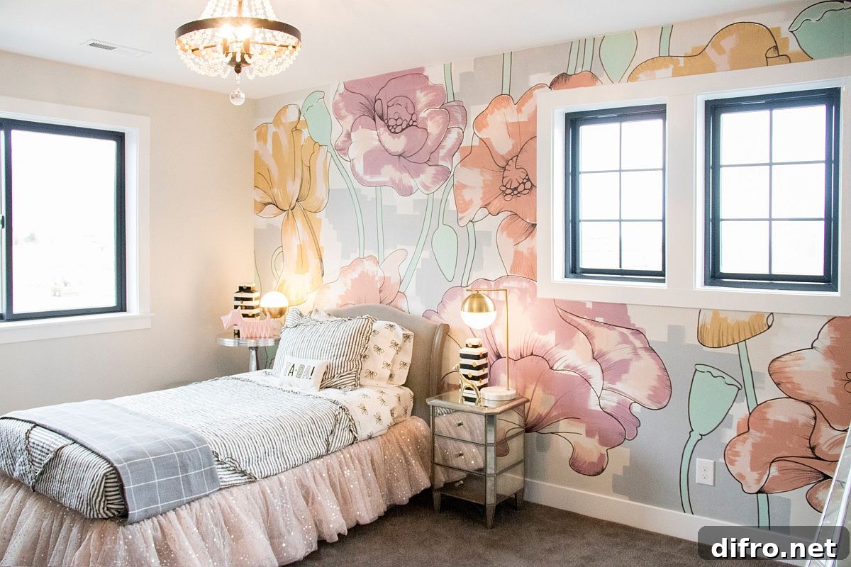 Flower-filled wallpaper and pastel hues in a small kids' room