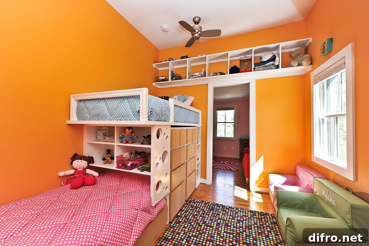 Bright orange walls in girls' bunk bedroom