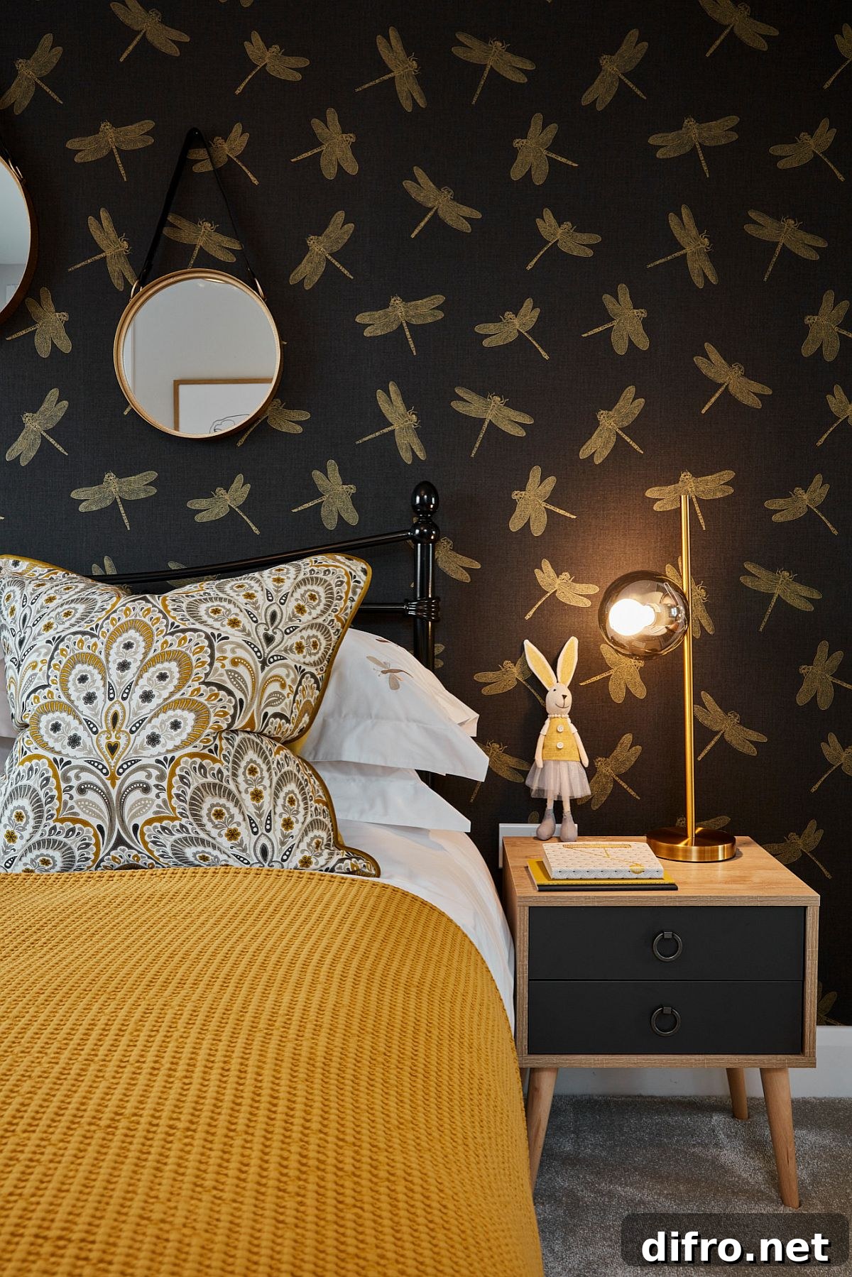 Yellow and black wallpaper in girls' room