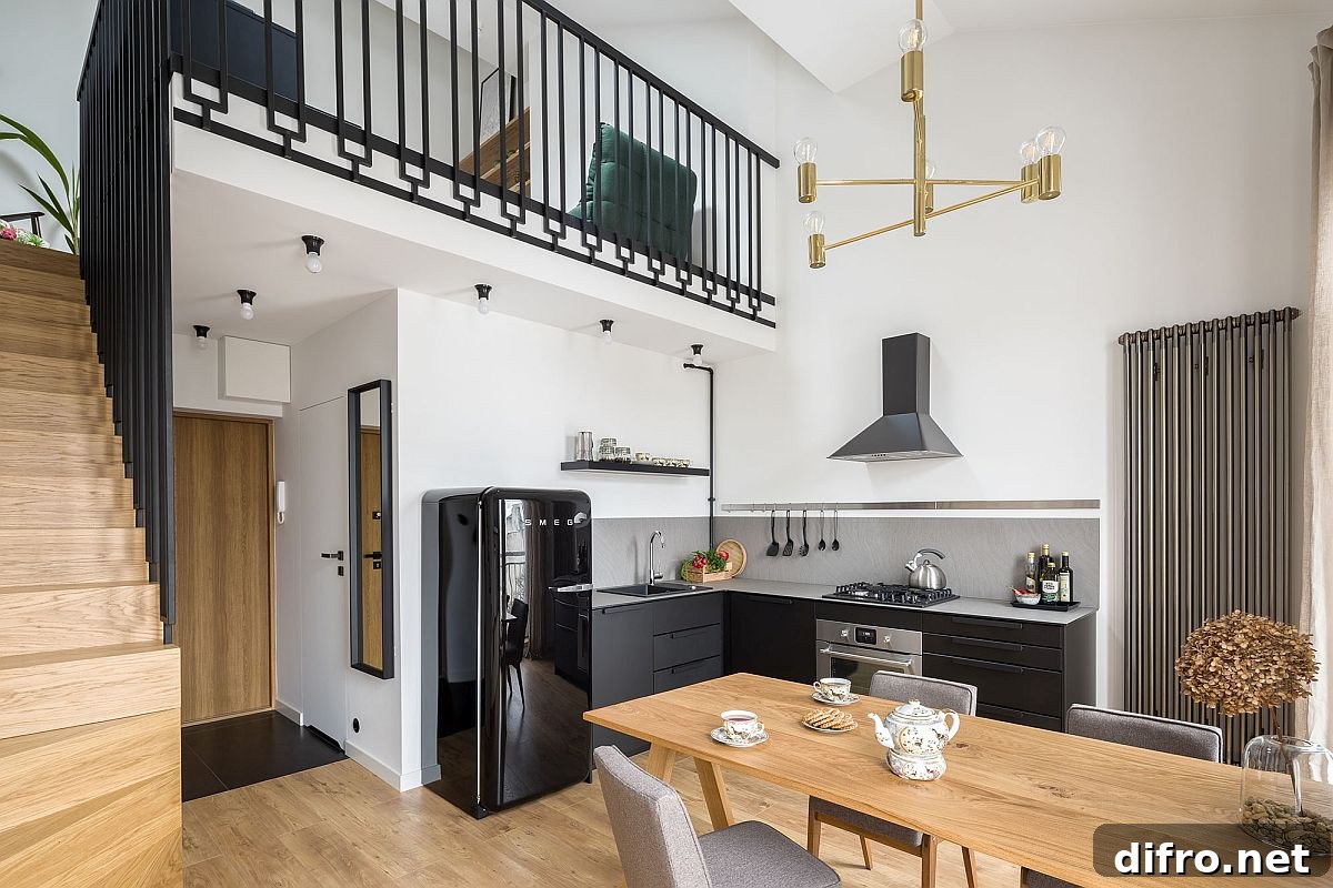 Dining area and kitchen sit on the lower level of the apartment while the bedroom and living area are nestled above
