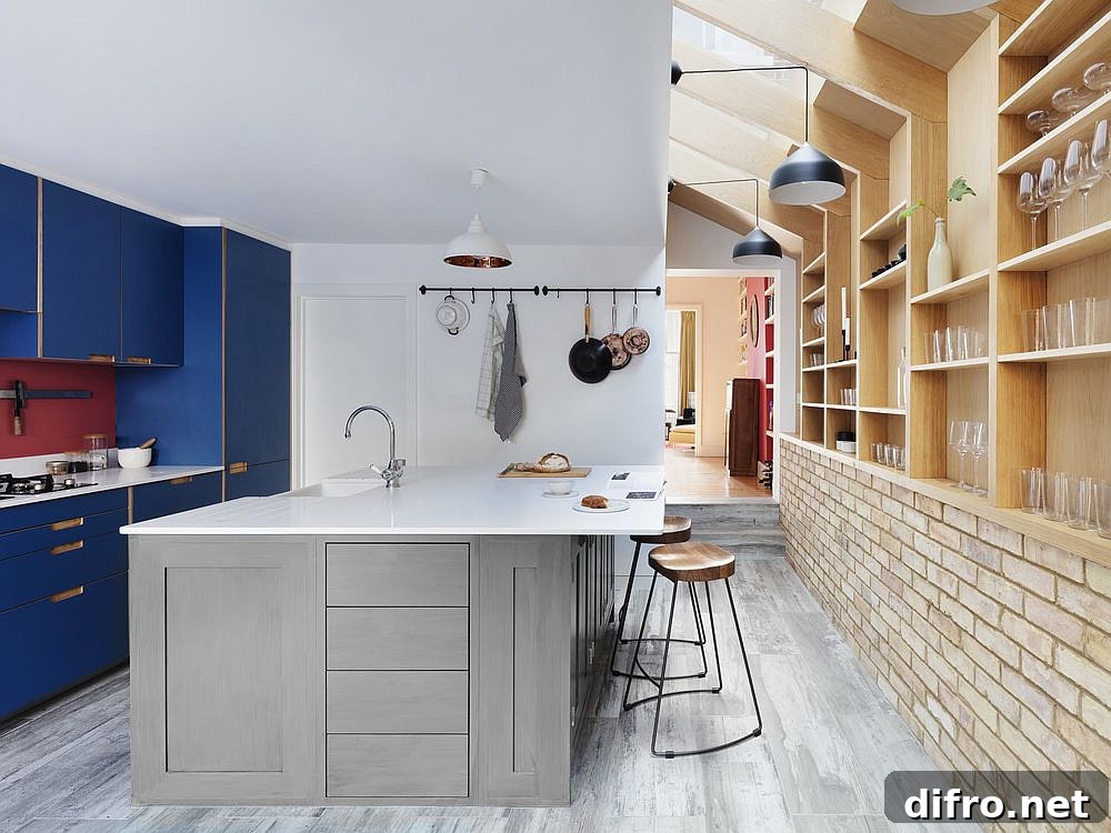 Blue kitchen cabinets in the Almington Street House